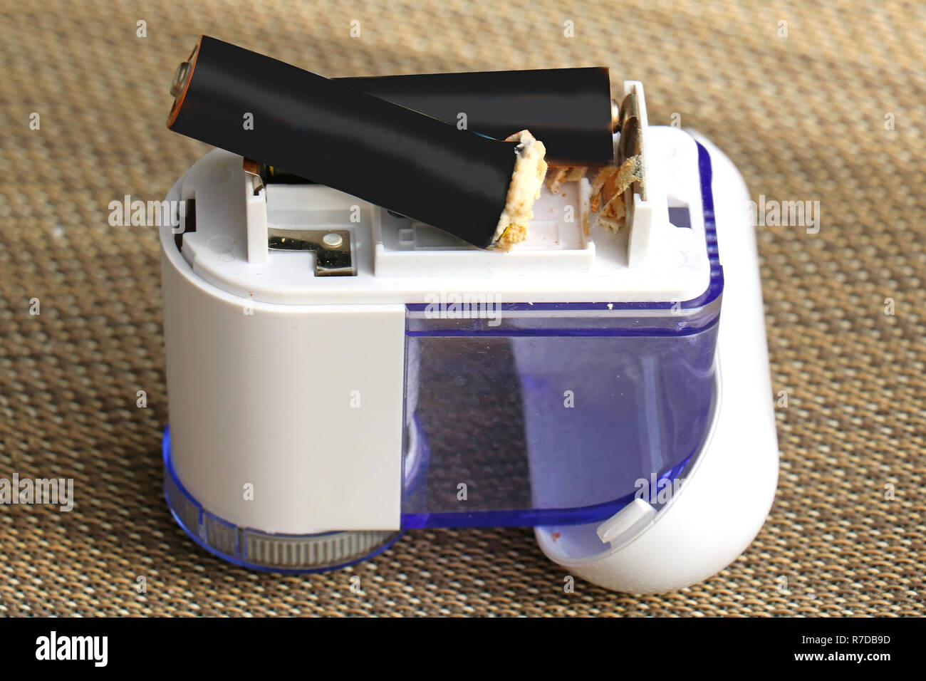 Small appliance with ruined battery that leaked acid which spilled