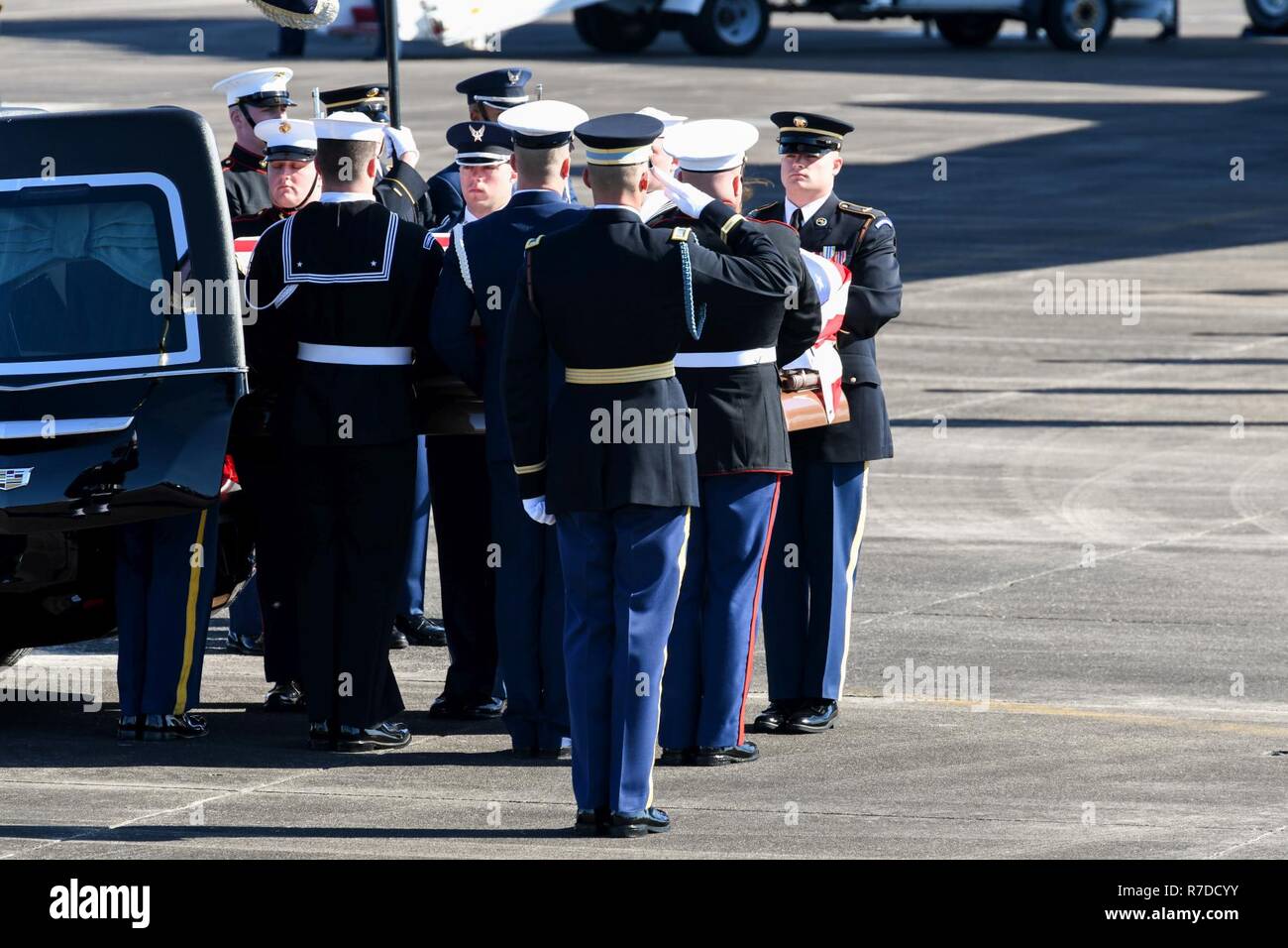 U.S. service members of the joint forces honor guard provide military honors during the departure of former President George H. W. Bush, the 41st President of the United States, from Ellington Field Joint Reserve Base, Texas Dec. 03, 2018. Nearly 4,000 military and civilian personnel from across all branches of the U.S. armed forces, including Reserve and National Guard components, provided ceremonial support during George H. W. Bush’s, the 41st President of the United States state funeral. (Air National Guard Stock Photo