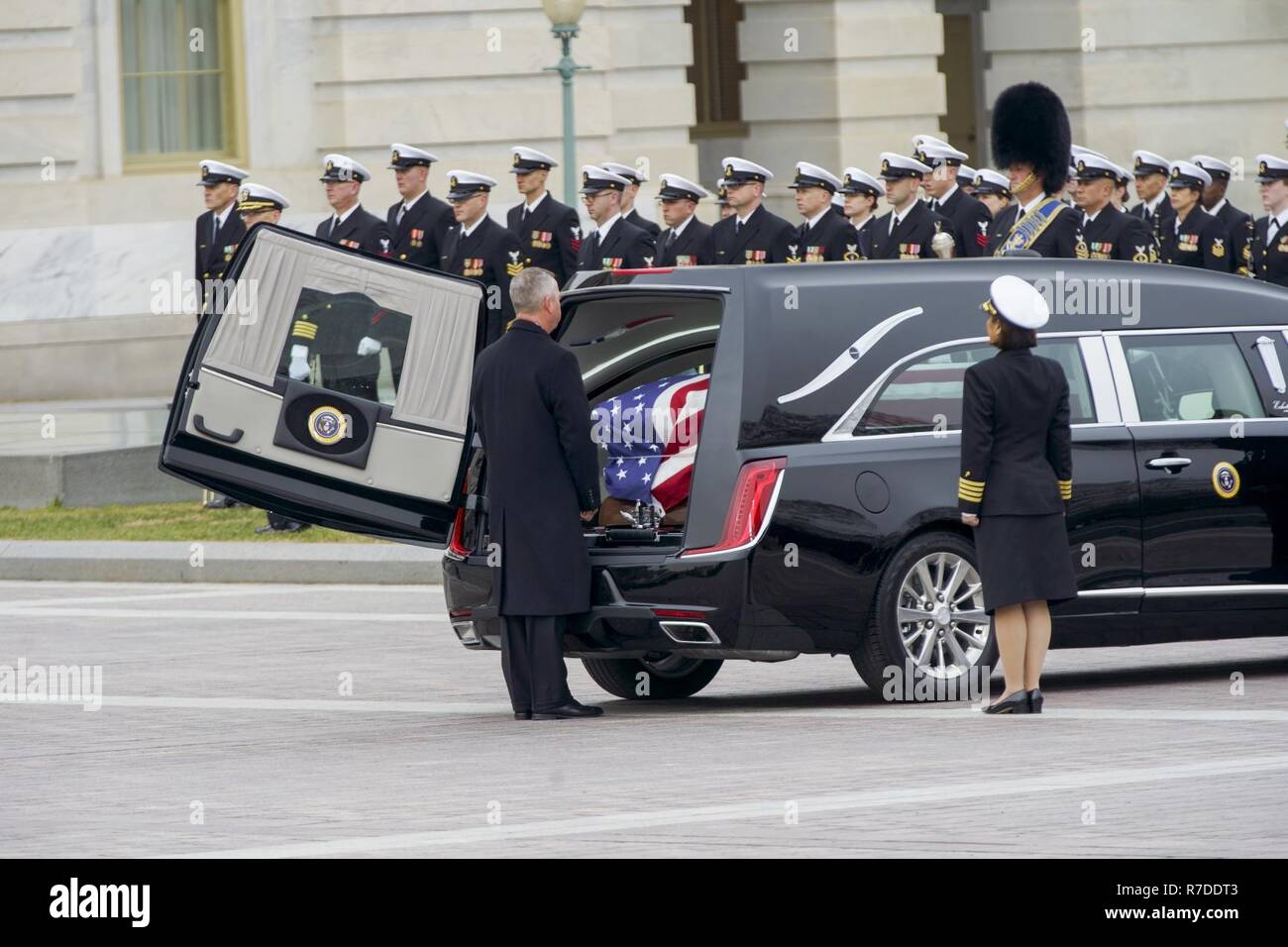 The hearse carrying the flag-draped casket of George H.W. Bush, 41st President of the United States, prepares to depart to the Washington National Cathedral, Washington, D.C., Dec. 5, 2018. Nearly 4,000 military and civilian personnel from across all branches of the U.S. armed forces, including Reserve and National Guard Components, provided ceremonial support during George H.W. Bush’s, the 41st President of the United States state funeral. (DoD Stock Photo