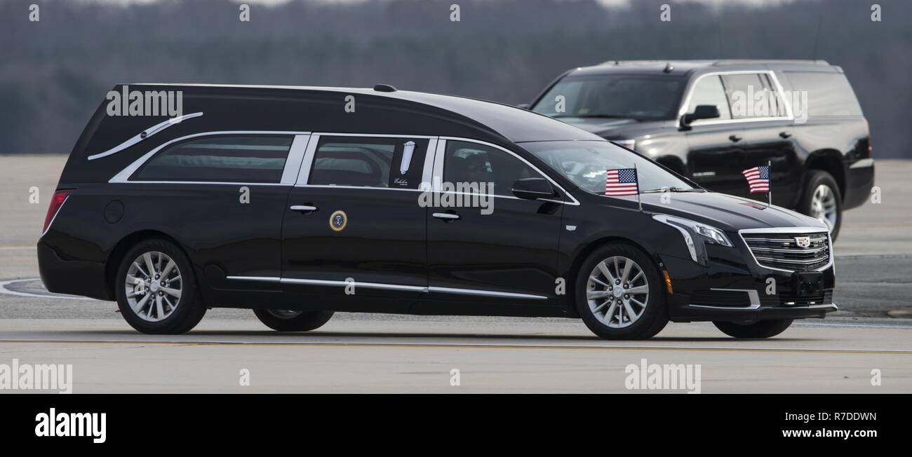 The remains of late President George H.W. Bush arrives onto the flightline of Joint Base Andrews on JBA, Md., Dec. 5, 2018. Nearly 4,000 military and civilian personnel from across all branches of the U.S. armed forces, including Reserve and National Guard components, provided ceremonial support during George H.W. Bush's, the 41st President of the United States state funeral. Stock Photo