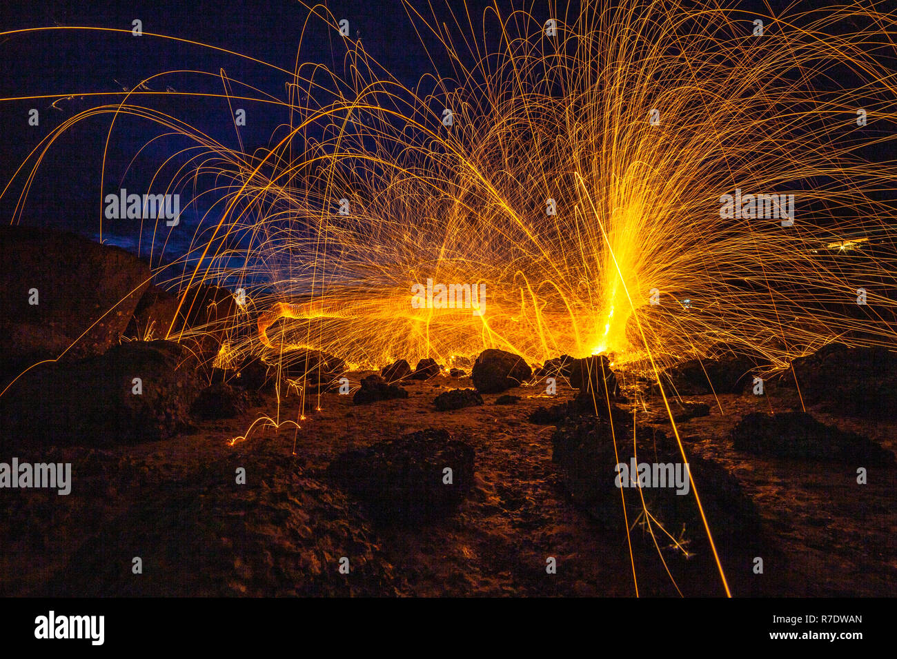 cool burning steel wool fire work photo experiments on the rock at