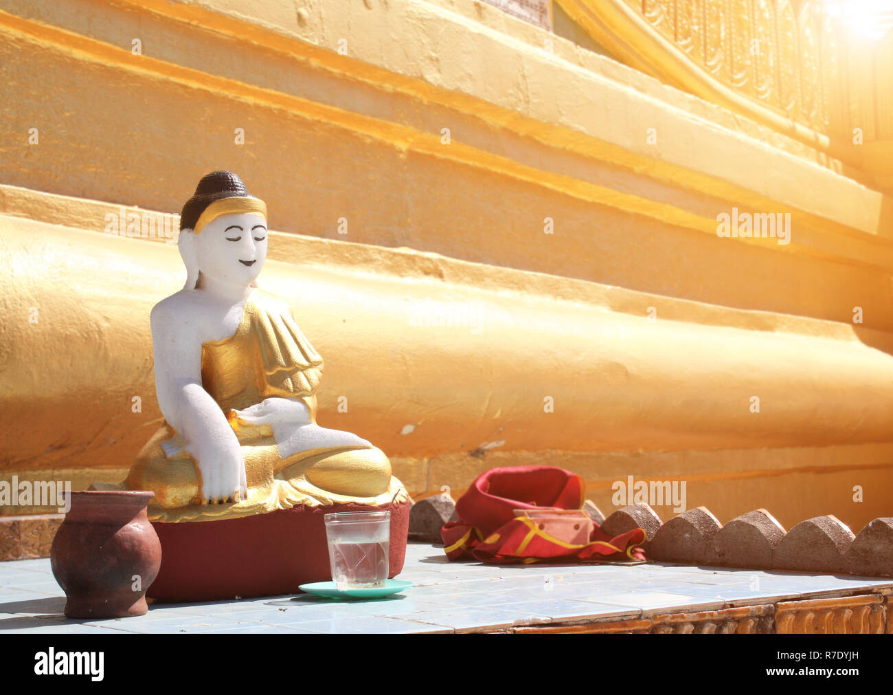 Old stone statue of meditating Buddha, Shwemawdaw Paya temple (Golden Temple), Bago, Bago Region, Myanmar (Burma) Stock Photo