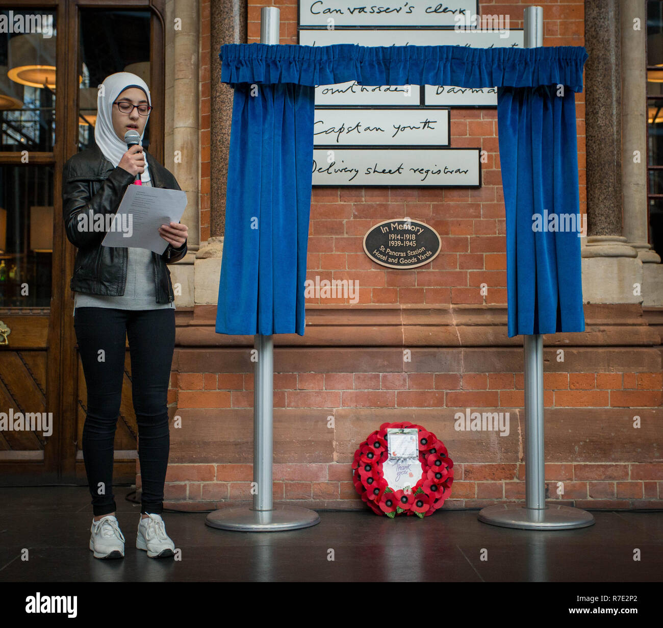 St. Pancras International reveals a permanent war memorial, the first ever in the station, on its 150th anniversary and the centenary of the end of World War I. The memorial is displayed on the station’s Grand Terrace, close to the location of bomb damage from two prominent air raids on the station.    The memorial was unveiled during a special service which included a reading from the station’s 15-year-old Poet Laureate and an exclusive performance from wartime choir the D-Day Darlings.  Featuring: Amineh Aboukerech Where: London, United Kingdom When: 08 Nov 2018 Credit: Wheatley/WENN Stock Photo