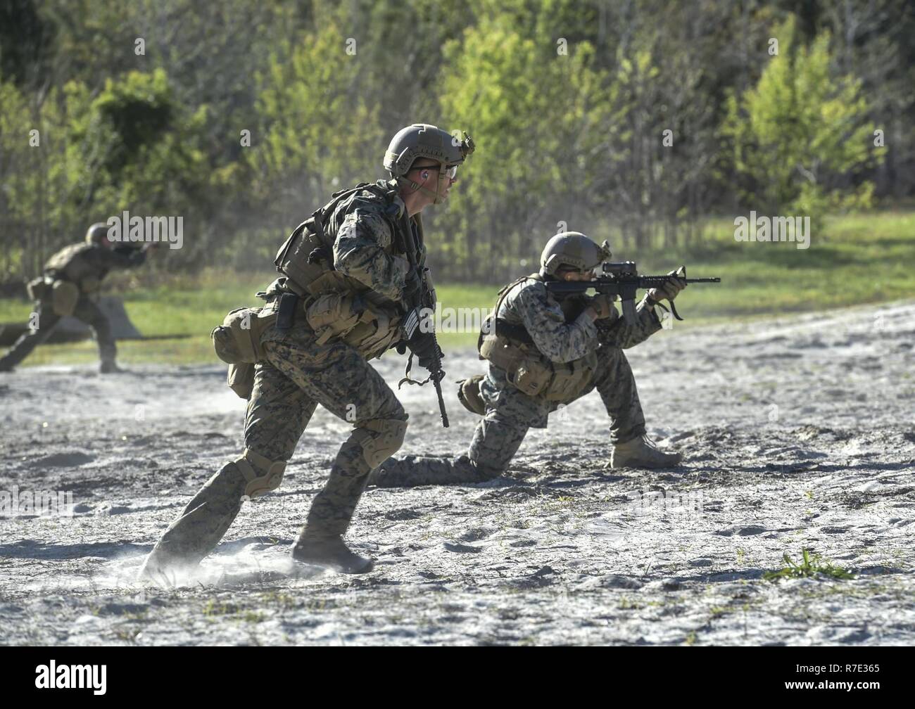 Marine Special Operations School Individual Training Course students run toward targets during