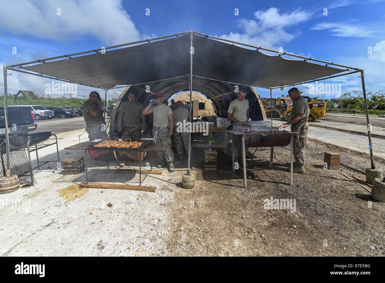 Members of the 254th Rapid Engineer Deployable Heavy Operational Repair Squadron Engineers cook