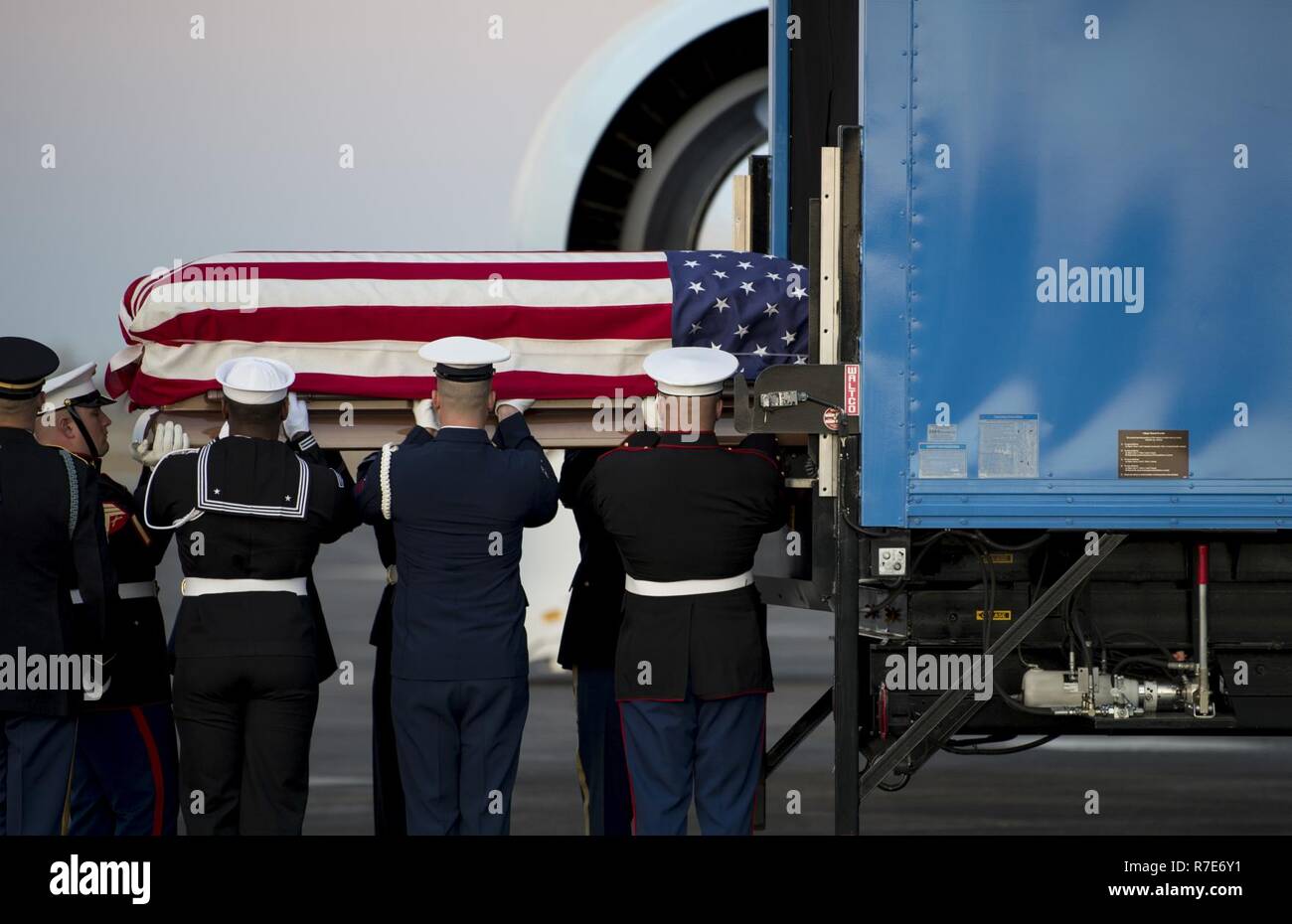 U.S. service members with the Joint Forces Honor Guard carry the casket of former U.S. President George H.W. Bush during an arrival ceremony at Ellington Field Joint Reserve Base in Houston, Texas, Dec. 5, 2018. Nearly 4,000 military and civilian personnel from across all branches of the U.S. armed forces, including Reserve and National Guard components, provided ceremonial support during the state funeral of George H.W. Bush, the 41st President of the United States. Stock Photo