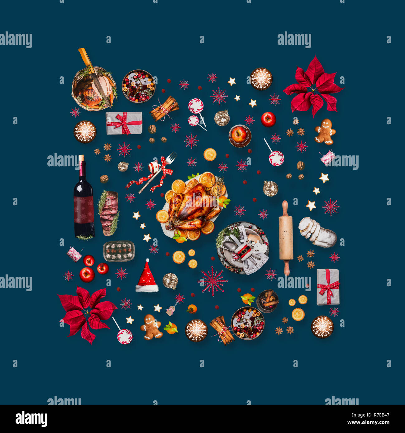 Various Christmas foods and red decoration for Christmas dinner. Composition pattern on dark blue background, top view Stock Photo