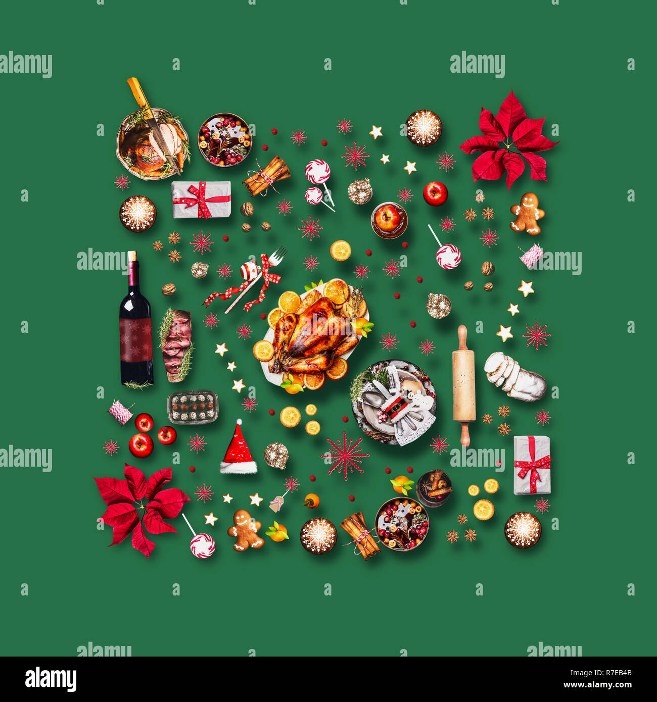 Various Christmas foods and red decoration for Christmas dinner. Composition pattern on green background, top view Stock Photo