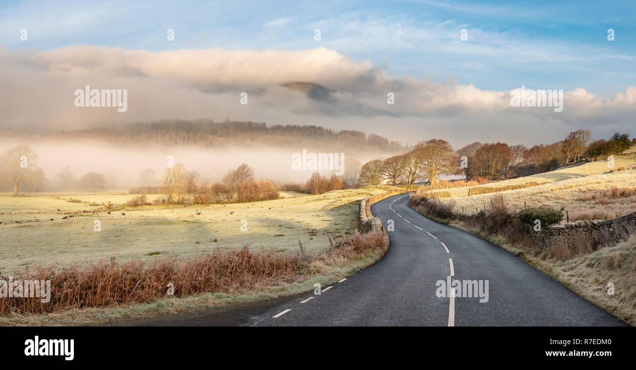 The road to Torver from Lowick as it winds it's way into the Lakeland Mountains.  Nikon D850, Nikkor 50mm f1.4 lens, f=13, 1/40th Second, ISO64 9 fram Stock Photo