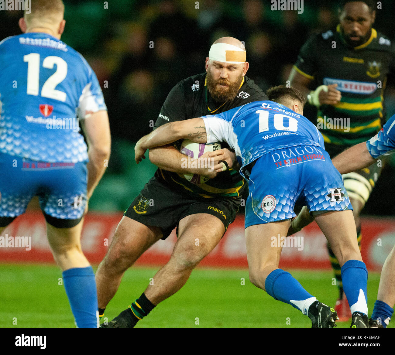 Northampton, UK. 8th December 2018. Ben Franks of Northampton Saints is tackled by Josh Lewis during the European Rugby Challenge Cup match between Northampton Saints and Dragons. Andrew Taylor/Alamy Live News Stock Photo
