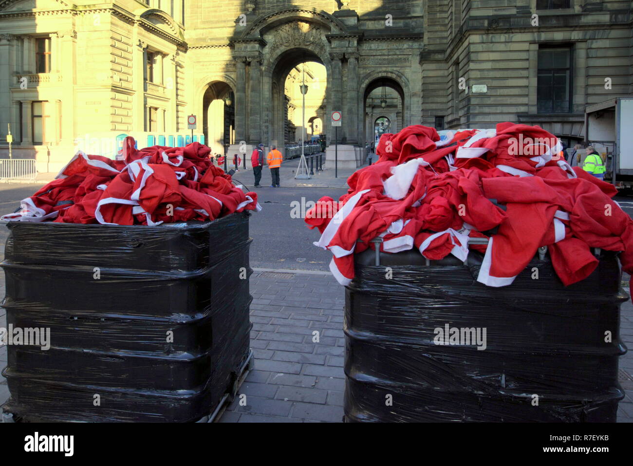 Glasgow, Scotland, UK, 9th December. Santa Dash Sunday saw the start and finish in the centre of the city in George as the Santas discarded their suits into bins after the race. Credit Gerard Ferry/Alamy news Stock Photo