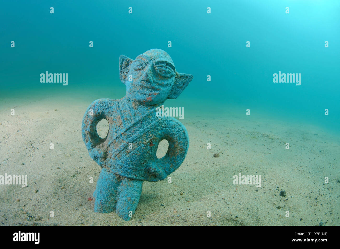 Antique statue at the bottom of lake baikal hires stock photography