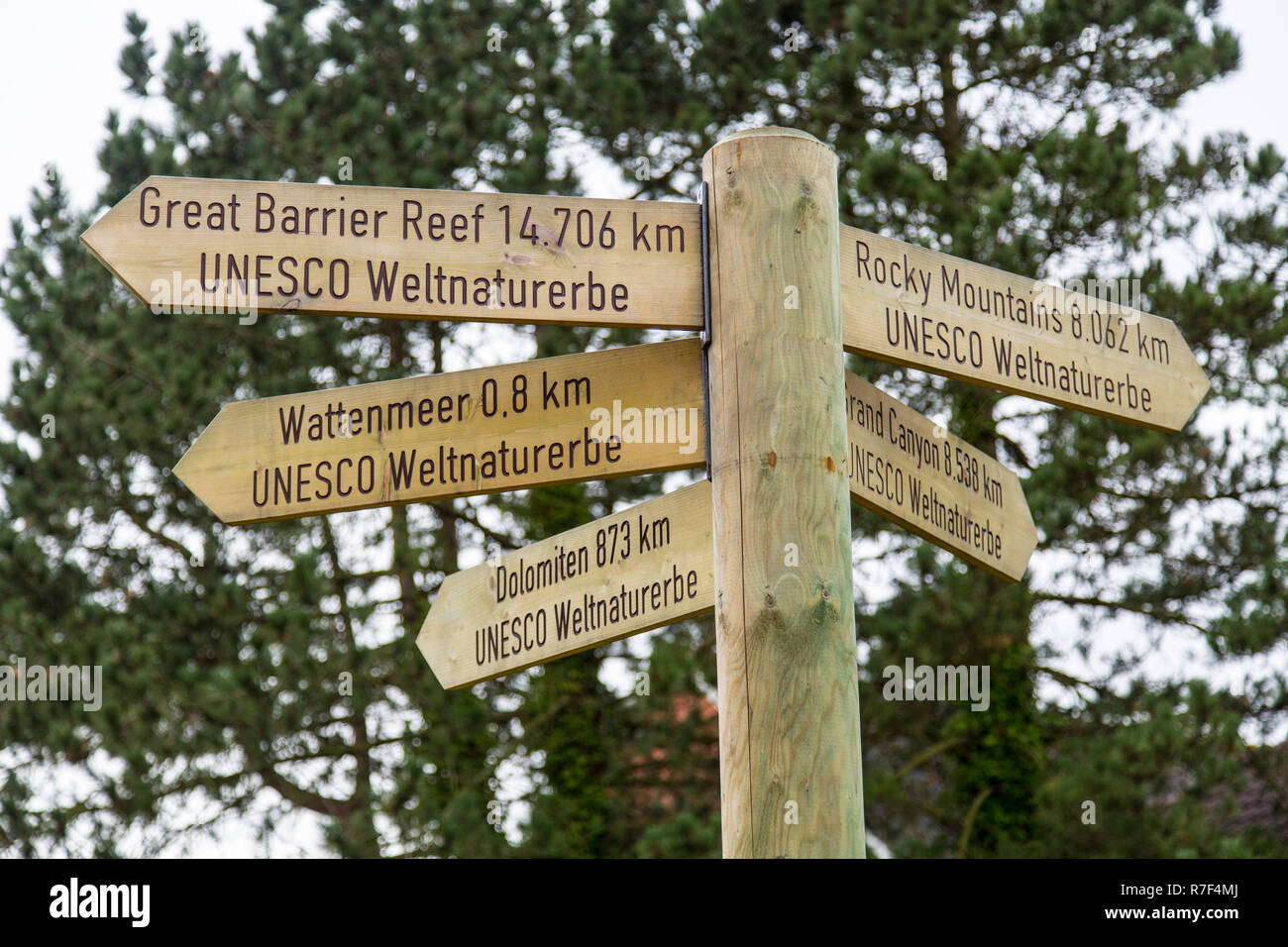 Signposts pointing to various UNESCO World Heritage Sites, Spiekeroog, East Frisia, Lower Saxony, Germany Stock Photo
