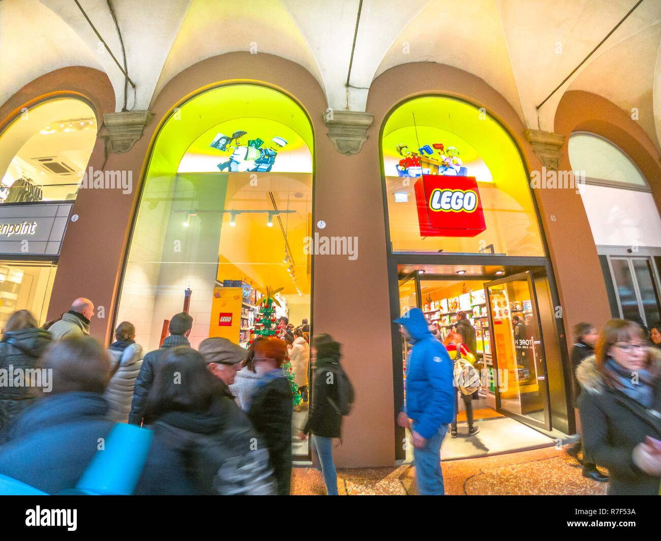 Bologna, Italy - December 6, 2018: Lego storefront of Bologna city with people passing by. LEGO is a line of plastic construction toys that are manufactured by The Lego Group in Billund, Denmark Stock Photo