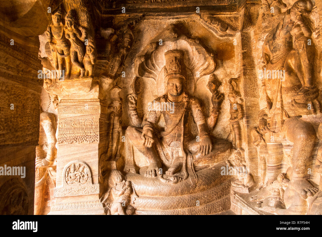 Lord Vishnu seated on Shesha Naga carved in the Badami Cave 1 at the badami  Temples in Badami in Karnataka, India. Stock Photo