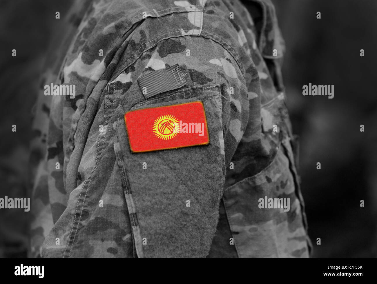Flag of Kyrgyzstan on soldiers arm. Flag of Kyrgyzstan on military uniforms (collage). Stock Photo