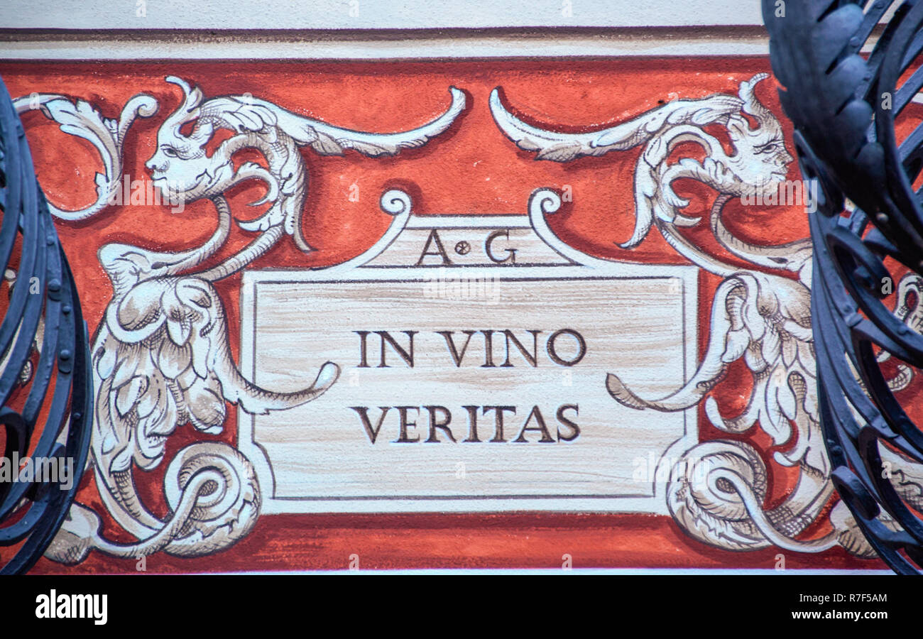 truth in wine, latin sign on a wall of Alba, Piedmont, Italy Stock