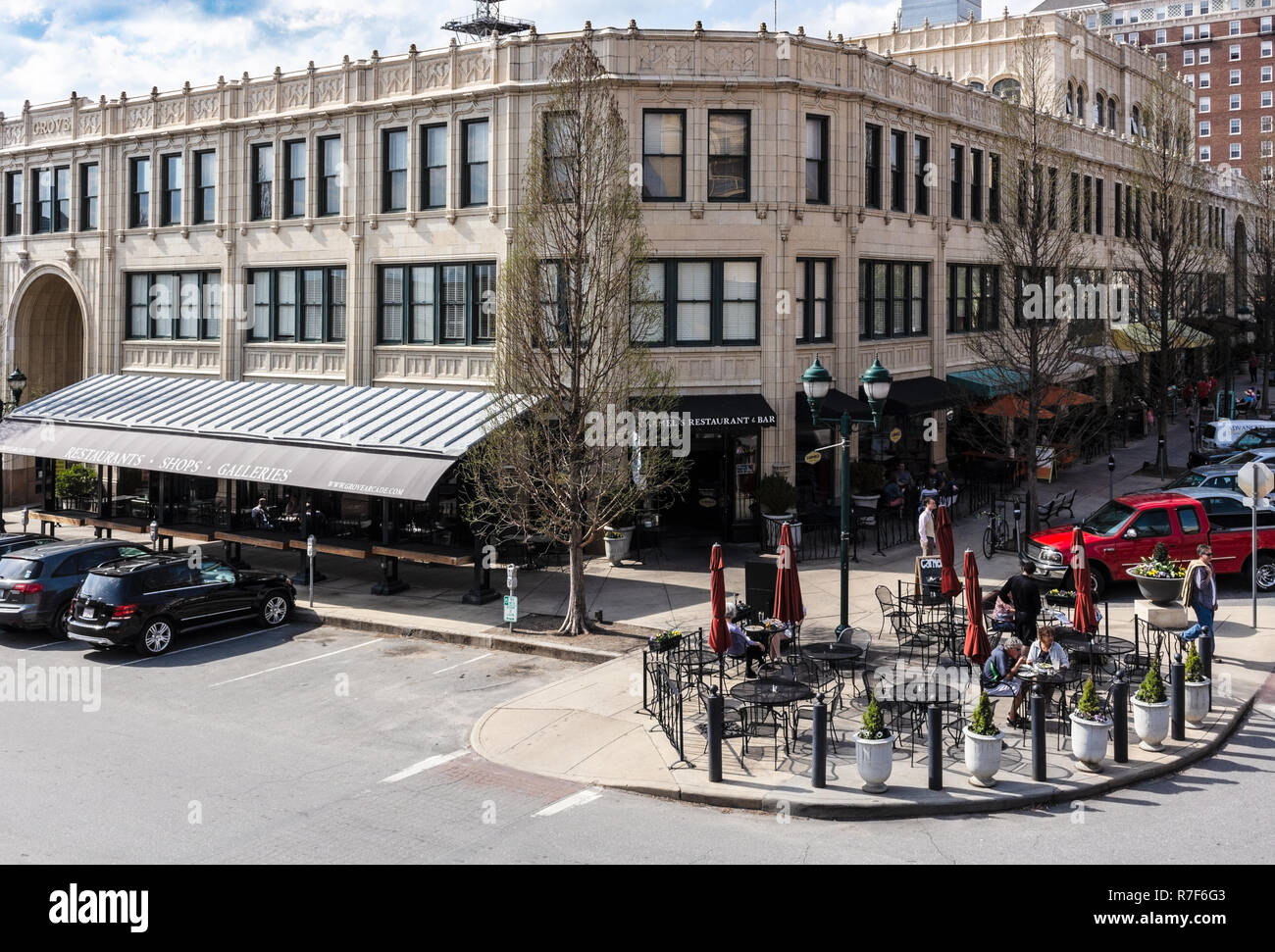 Tourists walk in front of The Grove Arcade in the Downtown Asheville
