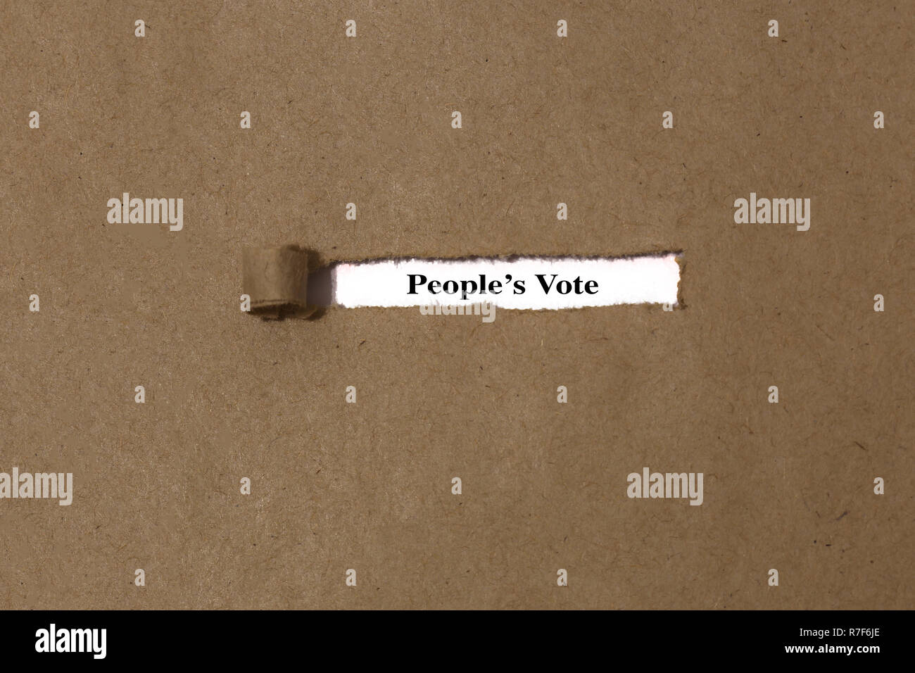 Ripped brown manilla envelope revealing the words people’s vote on white paper.  UK Brexit deal concept Stock Photo