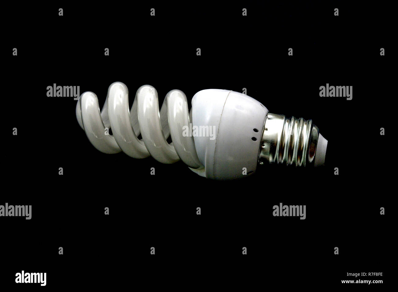 energy saving new lightbulb on black background Stock Photo