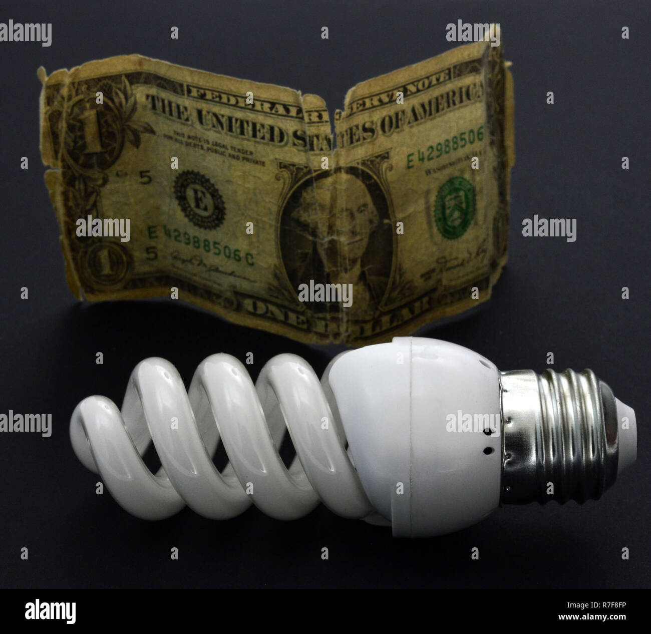 energy saving new lightbulb on black background Stock Photo