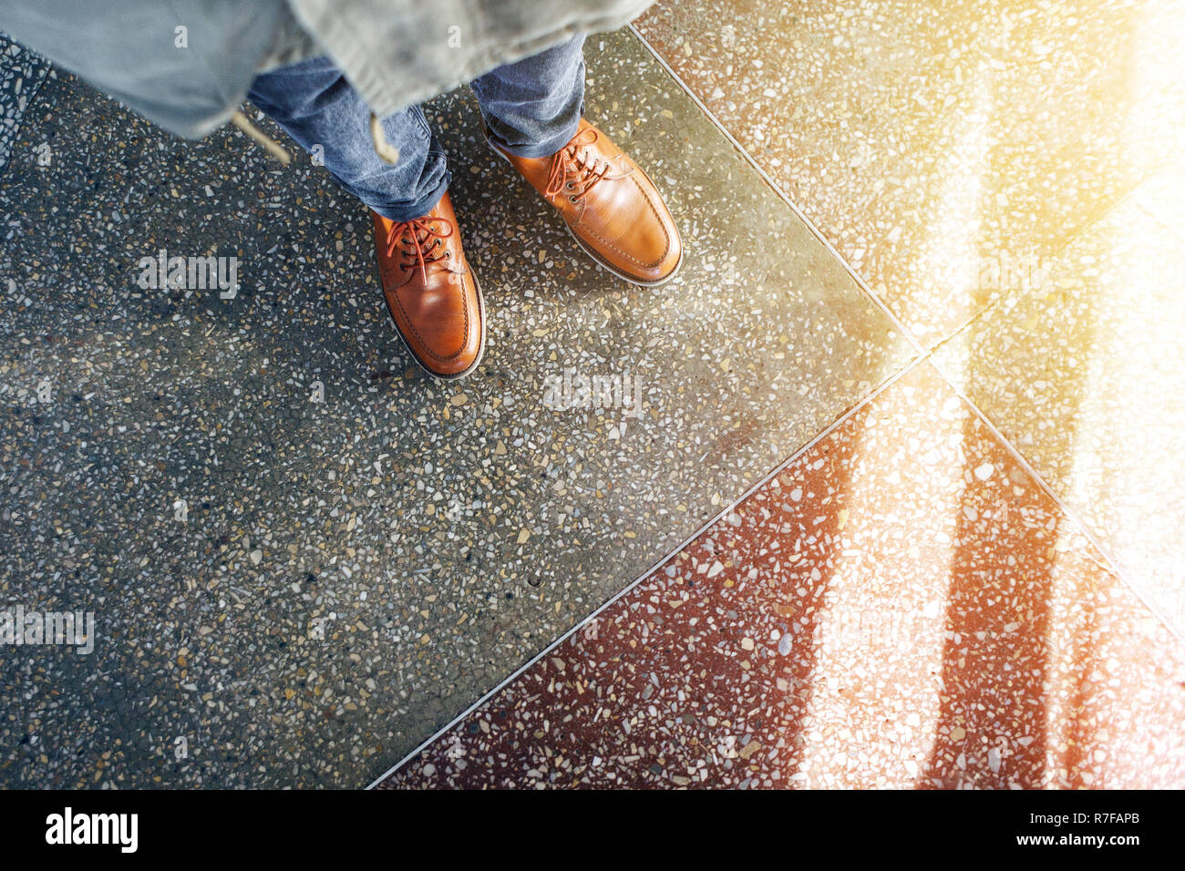 Top View Of Brown Leather Shoes Glare Of Sunlight On The Concrete
