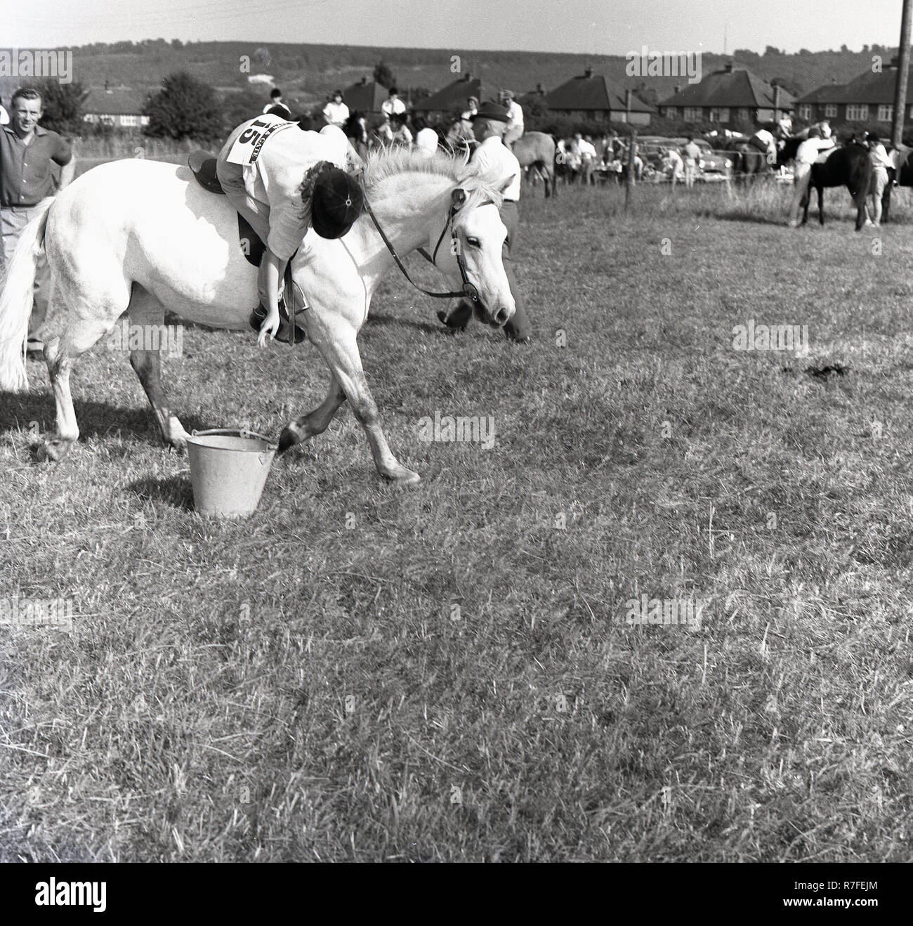 1964, a female competitor, a girl rider, at an outdoor equestrian event