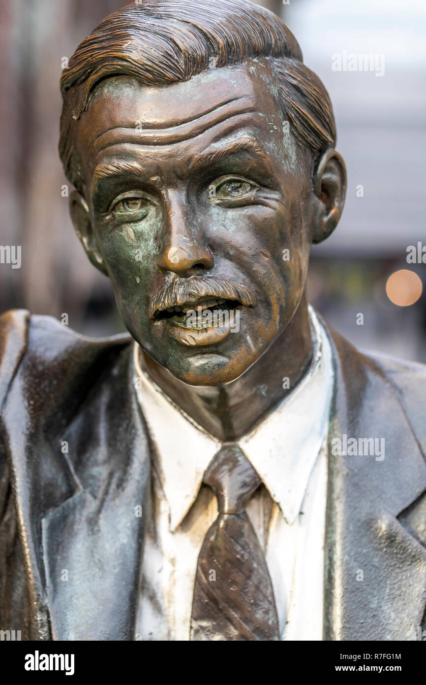 Bronze statue of a man hailing a New York cab now located on John Carpenter Street. London. UK Stock Photo