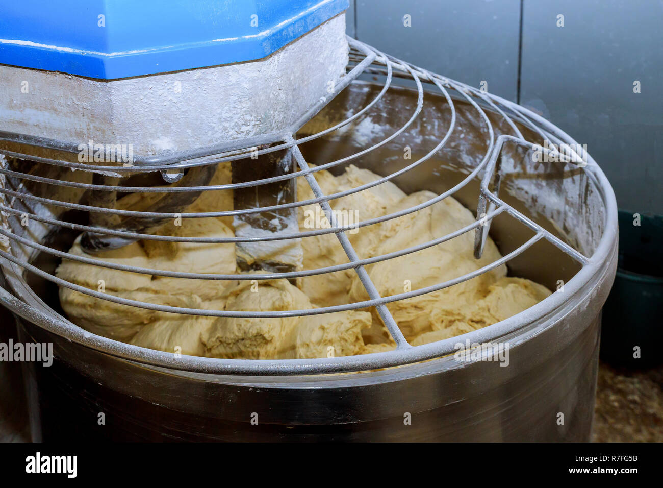 Bread Mixer In Bakery, mixing dough for baguettes in a bakery machine for  mixing dough Stock Photo - Alamy