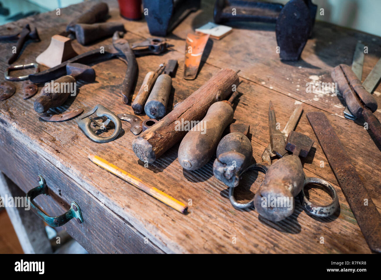 Detail of the wooden counter of a shoemaker. Stock Photo
