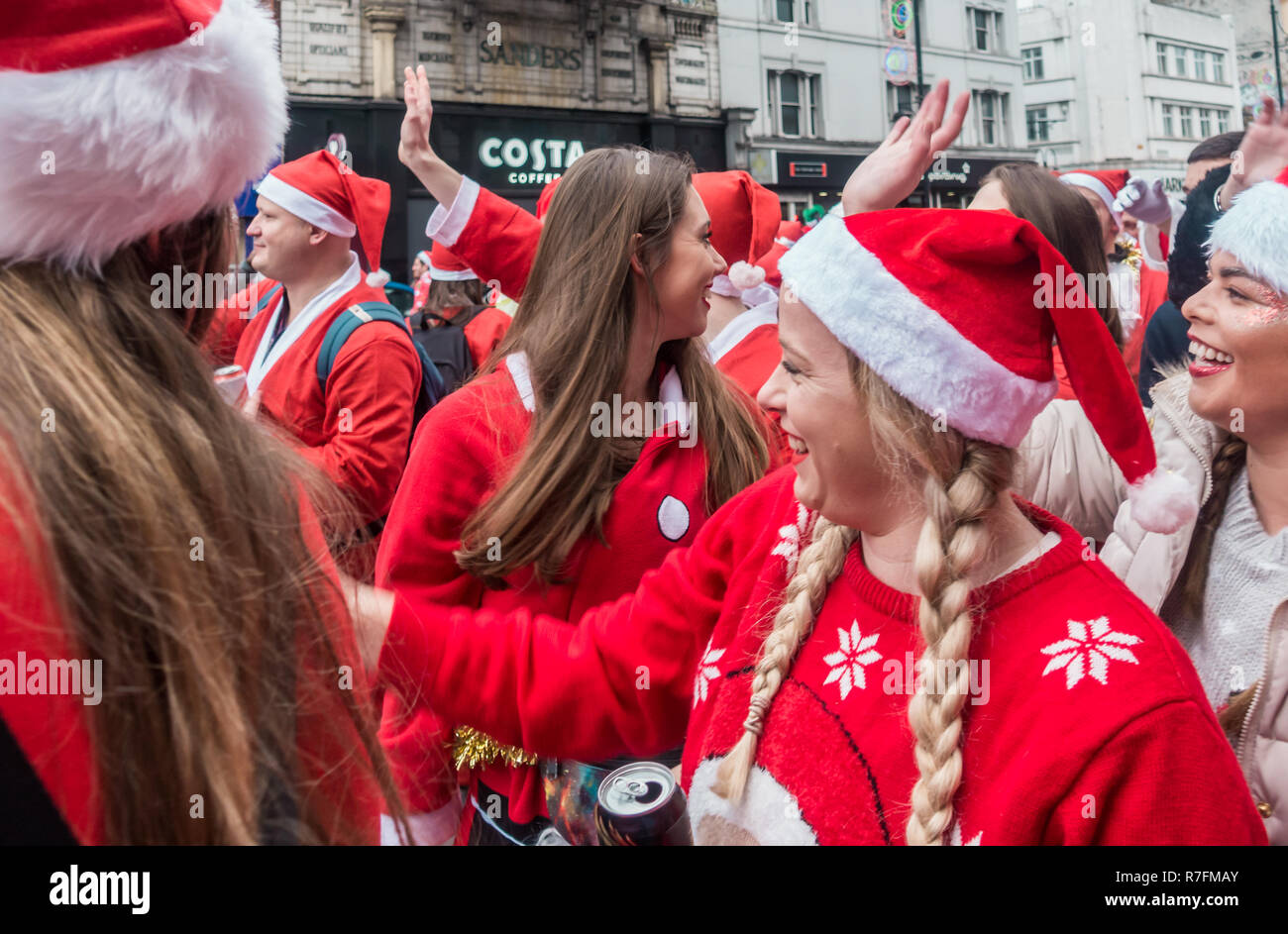 London, UK - December 2018 : Group of people dressed in santa outfits ...