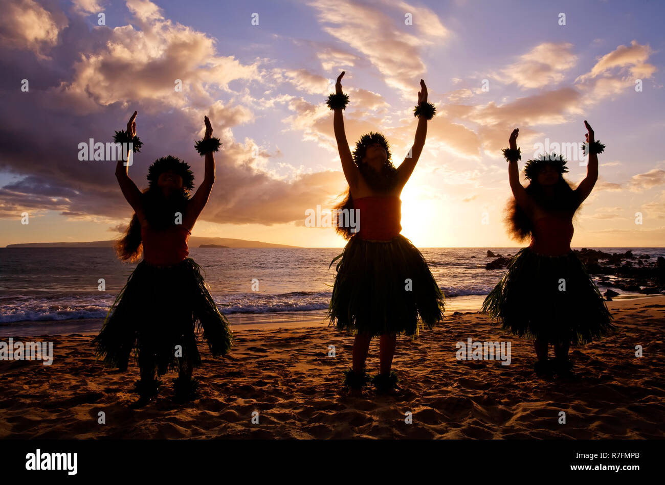 Three hula dancers on the beach at Palauea, Maui, Hawaii. Stock Photo