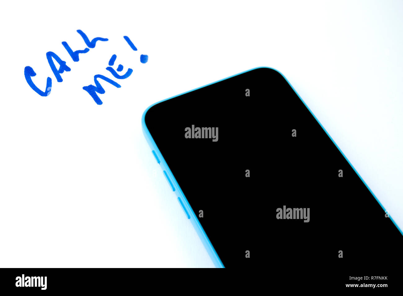 Light Blue Cellular Phone with a Call Me Message on White Background