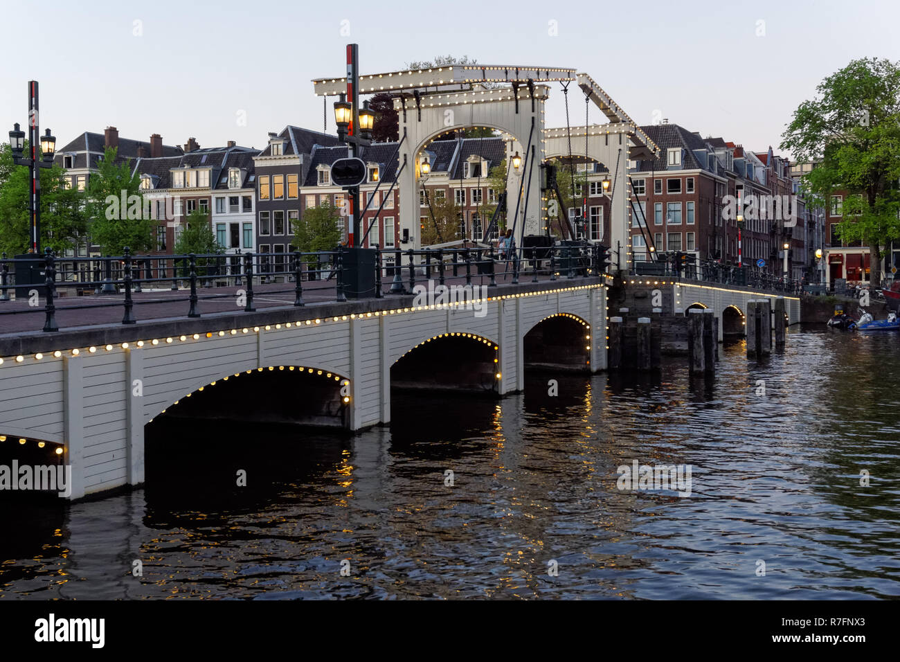 The Magere Brug (Skinny Bridge) over the river Amstel in Amsterdam, Netherlands Stock Photo