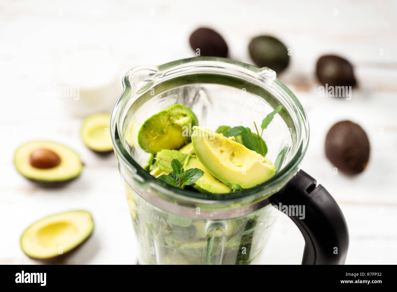Top view of blender with avocado peaces Stock Photo