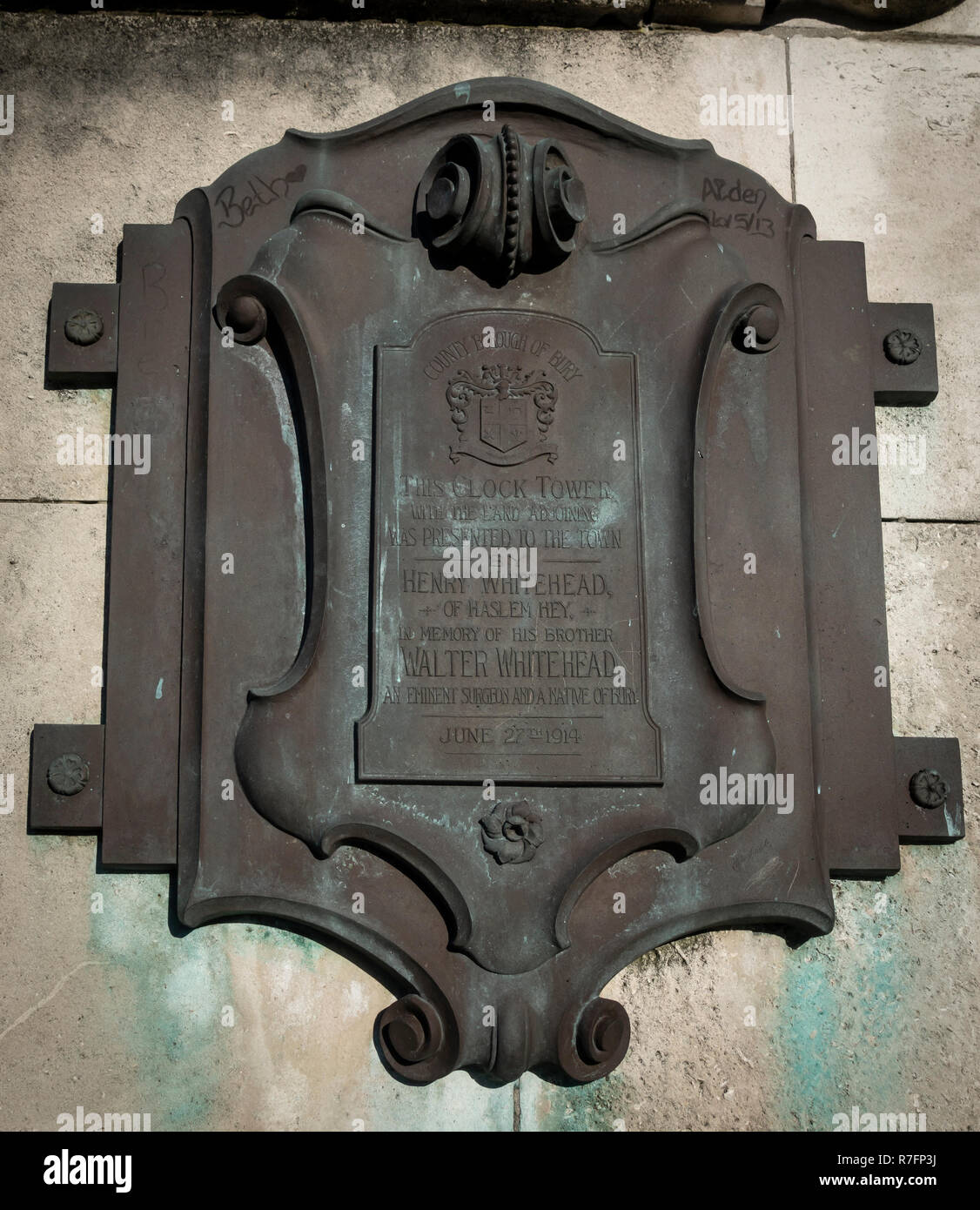 Bronze Plaque on Whitehead Clock Tower in Tower Gardens, Bury, Lancashire. Stock Photo