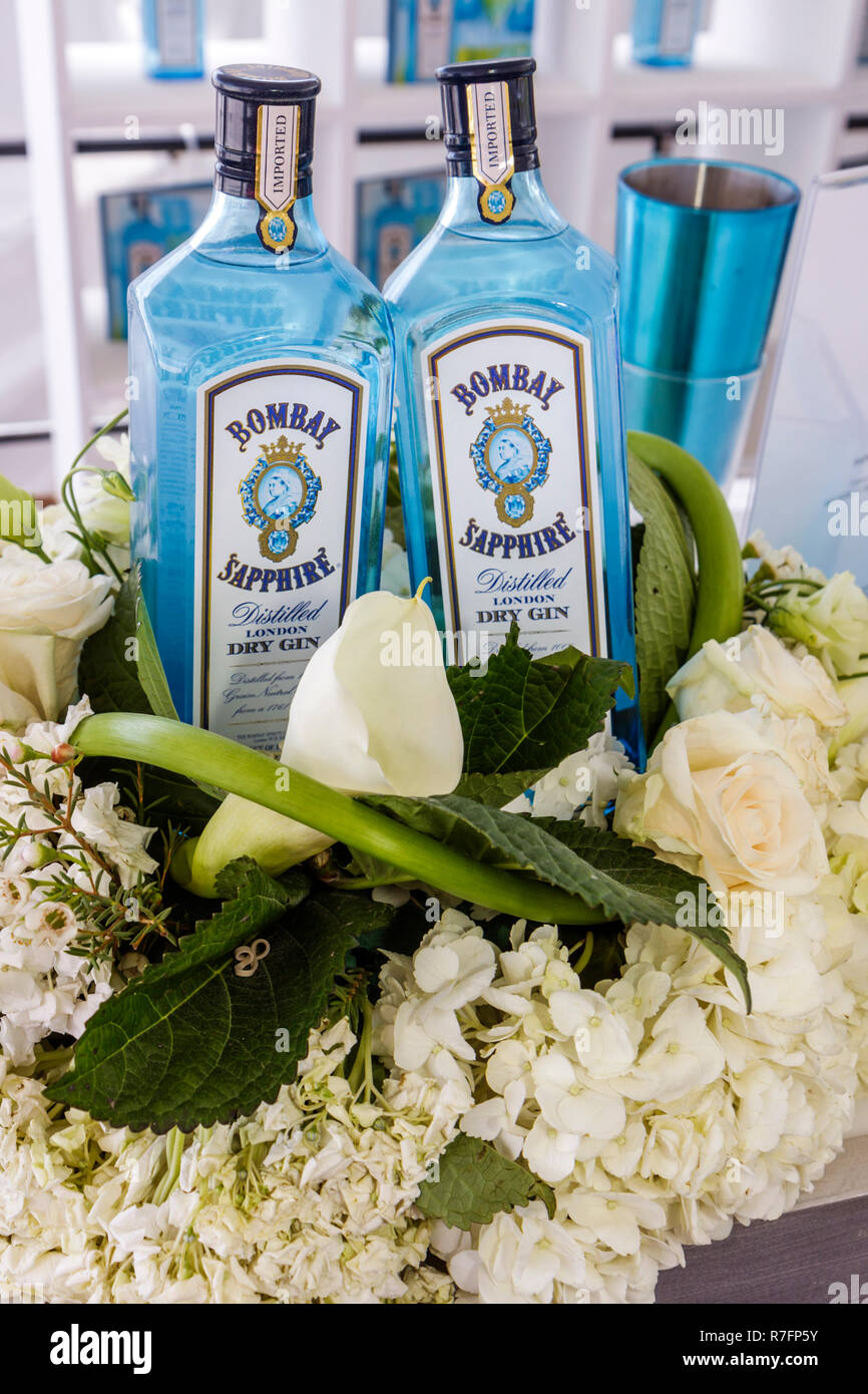 Miami Beach Florida,Polo World Cup Matches,sport,tournament,equestrian sand field,sponsor,Bombay Sapphire,gin,bottle,display sale floral arrangement,p Stock Photo