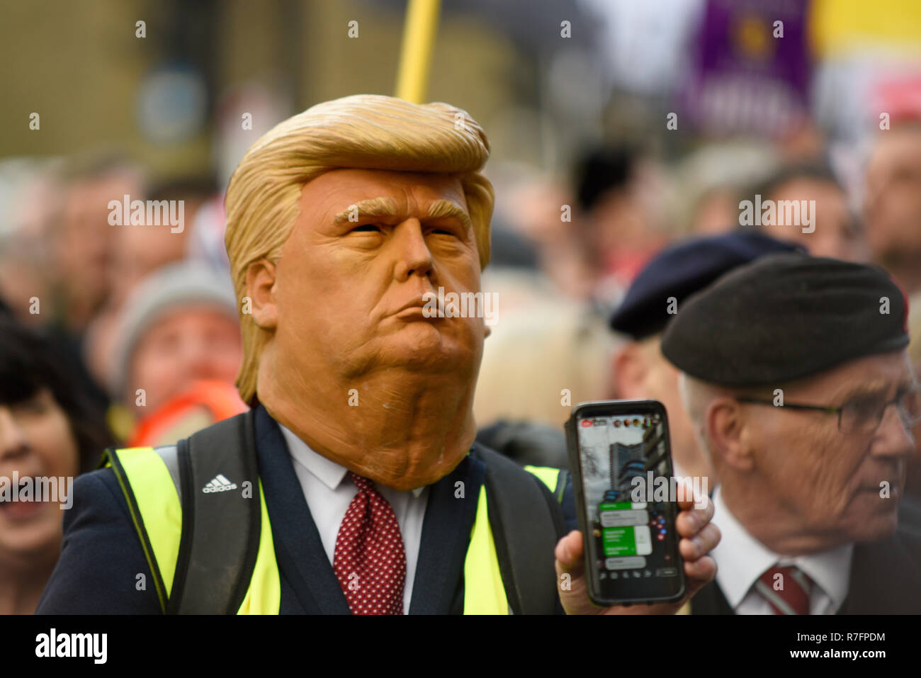 Brexit Betrayal March in London days before the planned Parliament vote. Tommy Robinson supporter in Donald Trump mask Stock Photo