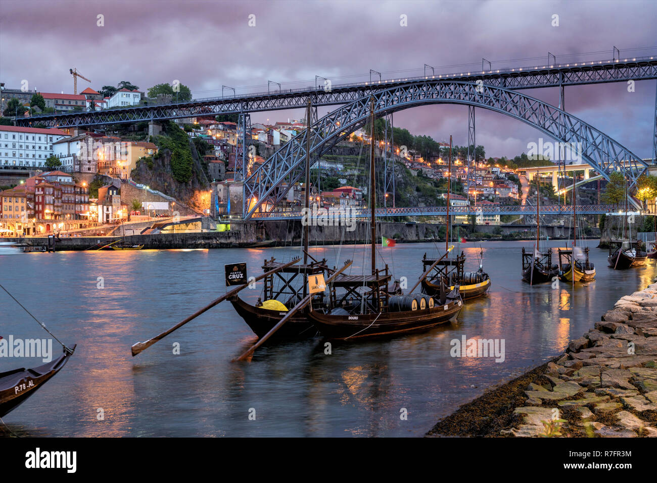traditional Rabelo boats, Douro river, cityscape, panorama, twilight,  Porto, Portugal Stock Photo