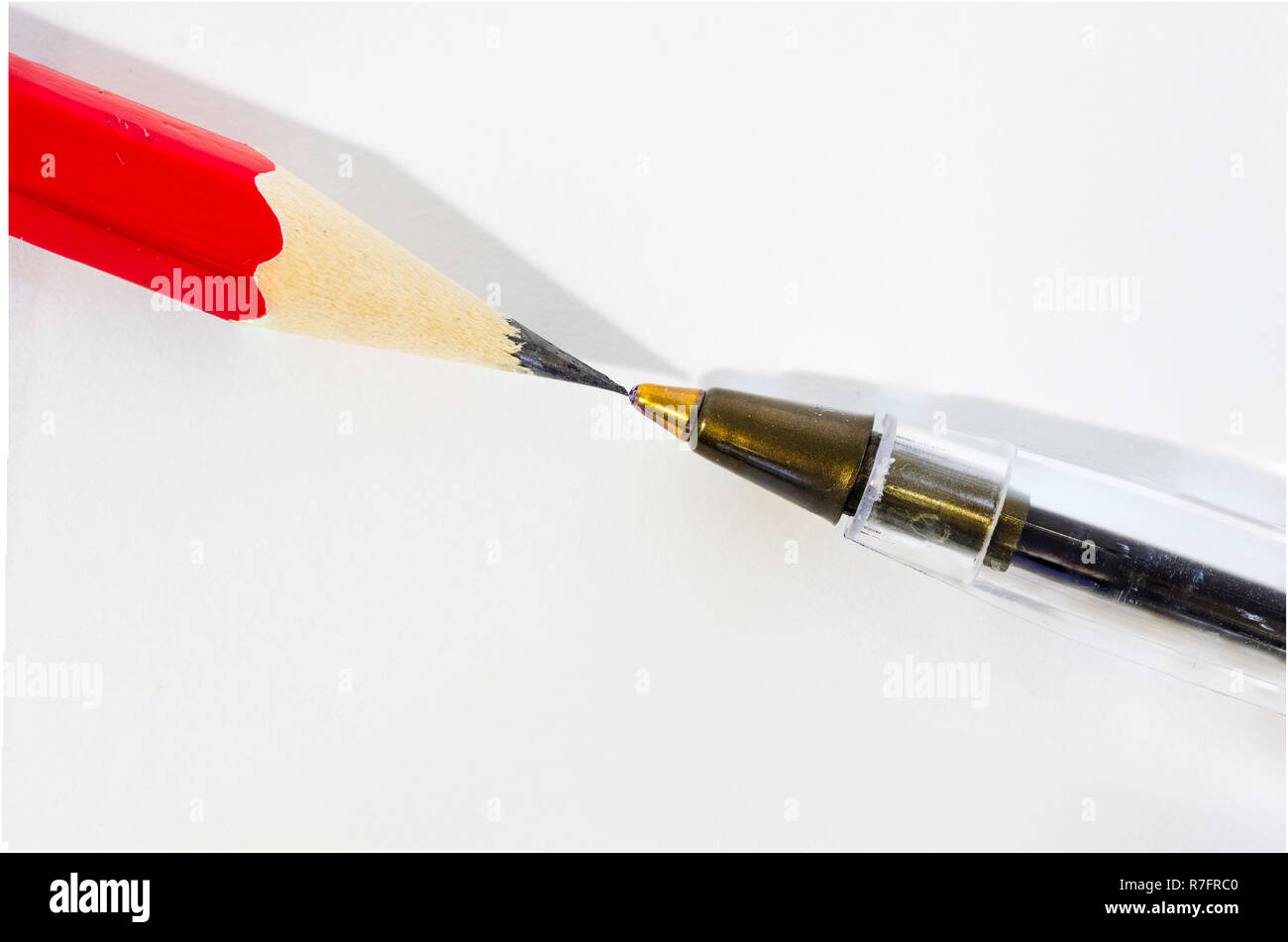 pencil and pens opposite, contrast, struggle between ancient and modern