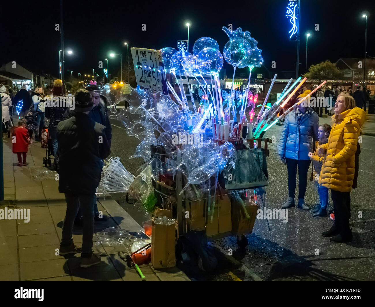 Annual Christmas Parade at Marske by the Sea North Yorkshire a stall selling brightly lit decorations for children in the  village square Stock Photo