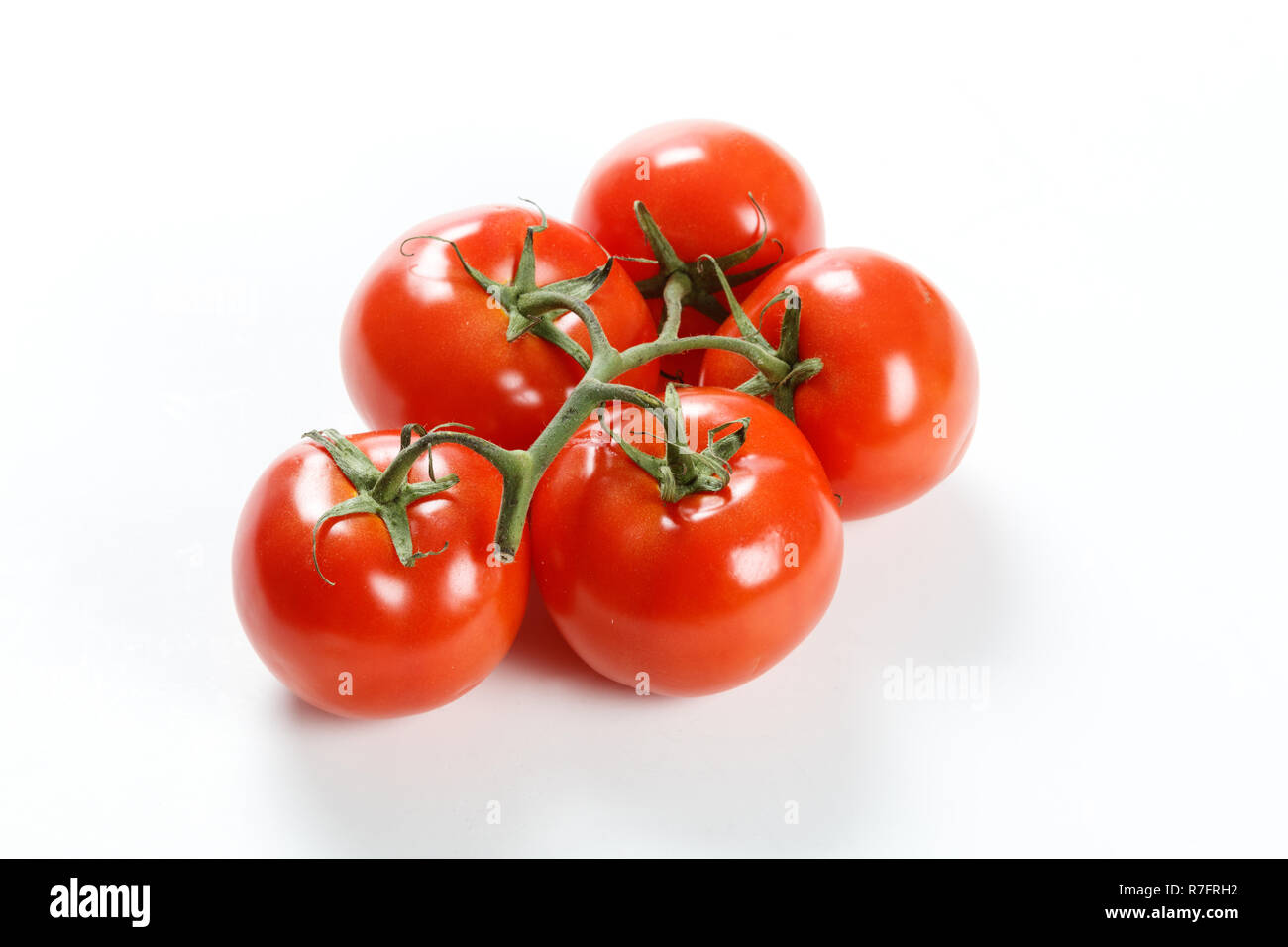 Red Tomato Group isolated on white background Stock Photo - Alamy