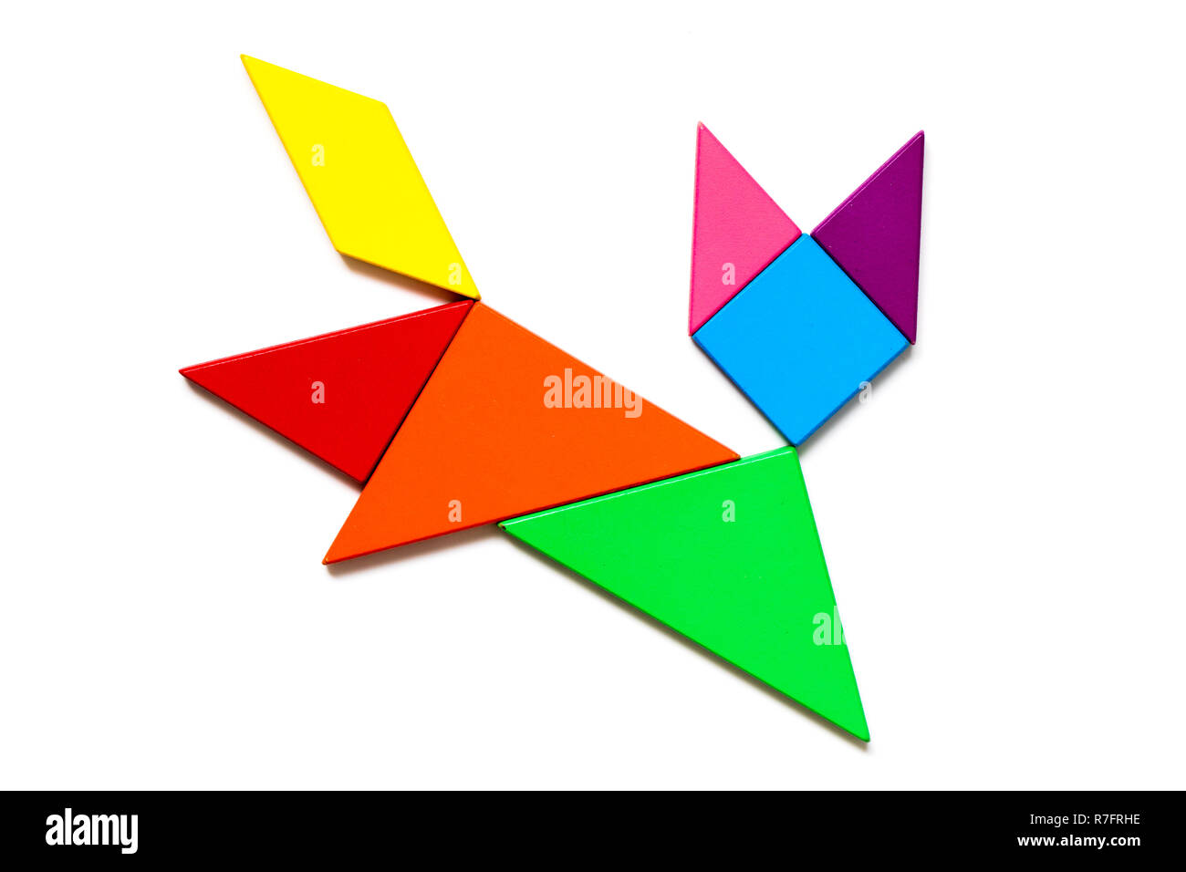 Color wood tangram puzzle in cat shape on white background Stock Photo -  Alamy