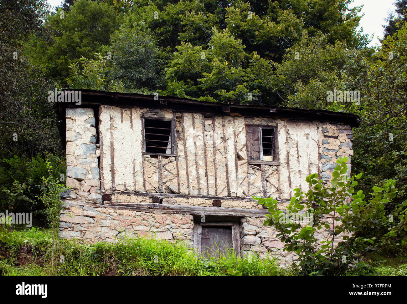 View of traditional, wooden/stone house at high plateau and forest. The image is captured in Trabzon/Rize area of Black Sea region located at northeas Stock Photo
