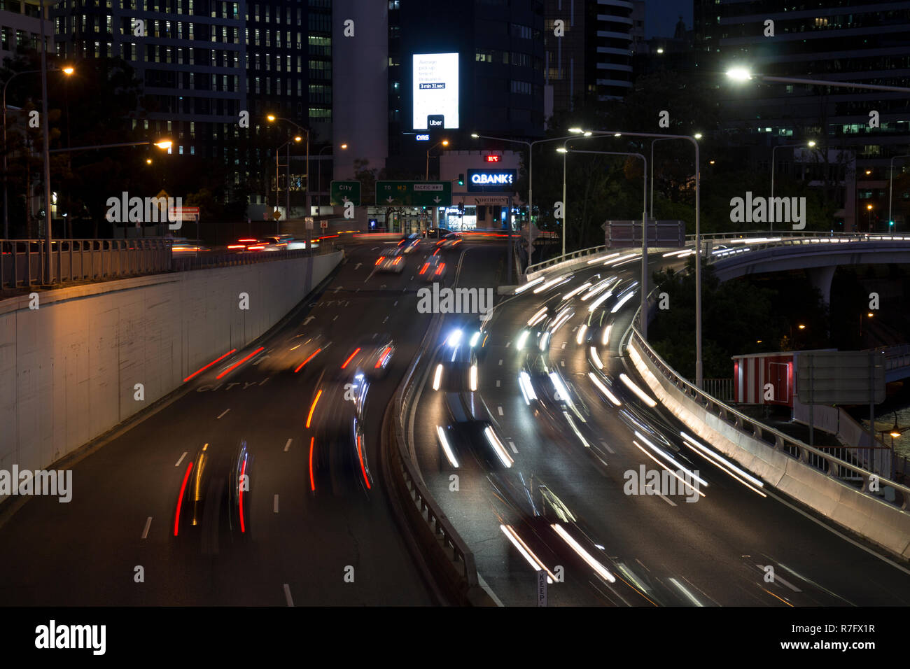 Evening traffic light trails on the Riverside Expressway, North Quay, Brisbane city centre, Queensland, Australia Stock Photo