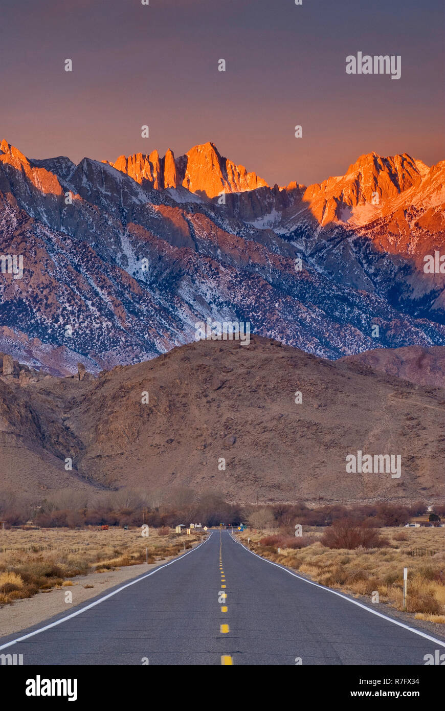 Mount Whitney in Eastern Sierra Nevada with Alabama Hills in foreground at sunrise in winter from State Highway 136 near Lone Pine, California, USA Stock Photo