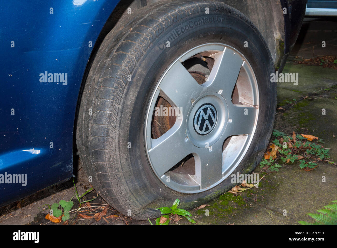 Deflated tyre on a Volkswagen car, UK. Stock Photo