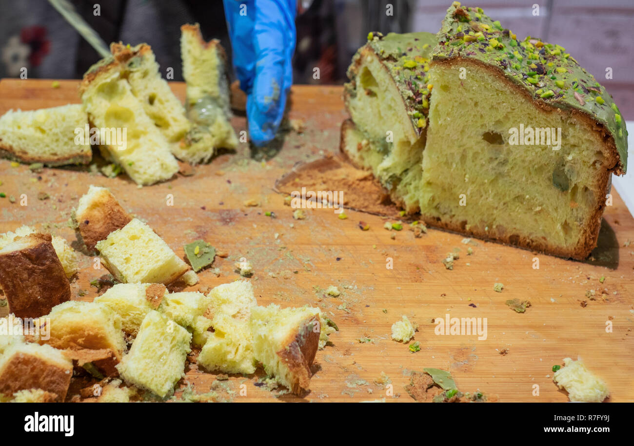 Panettone, the typical Christmas cake of Milan, filled with pistachio cream Stock Photo