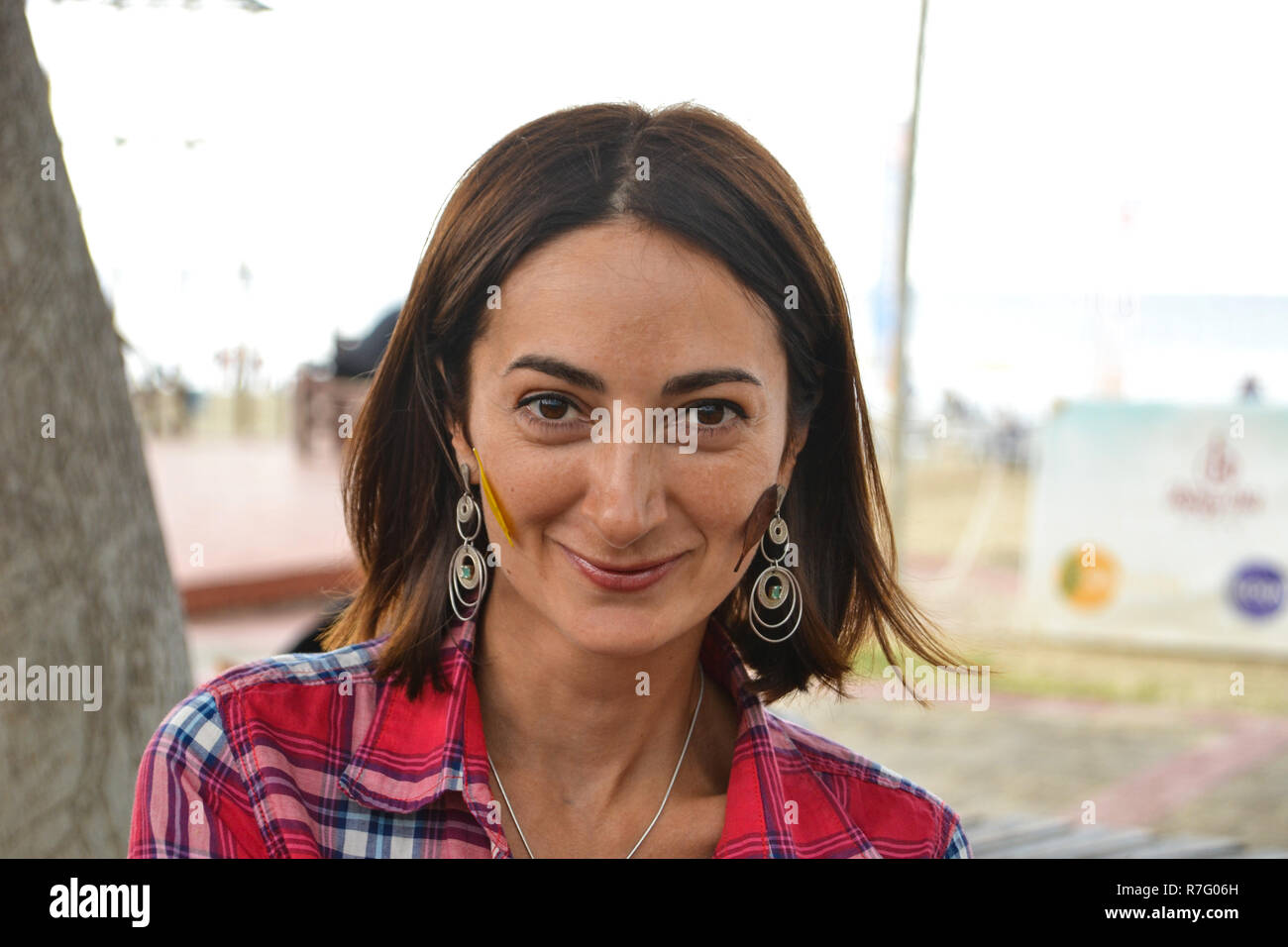 Portrait of beautiful russian brunette woman with dark brown eyes and  lovely smile, red chemise Stock Photo - Alamy