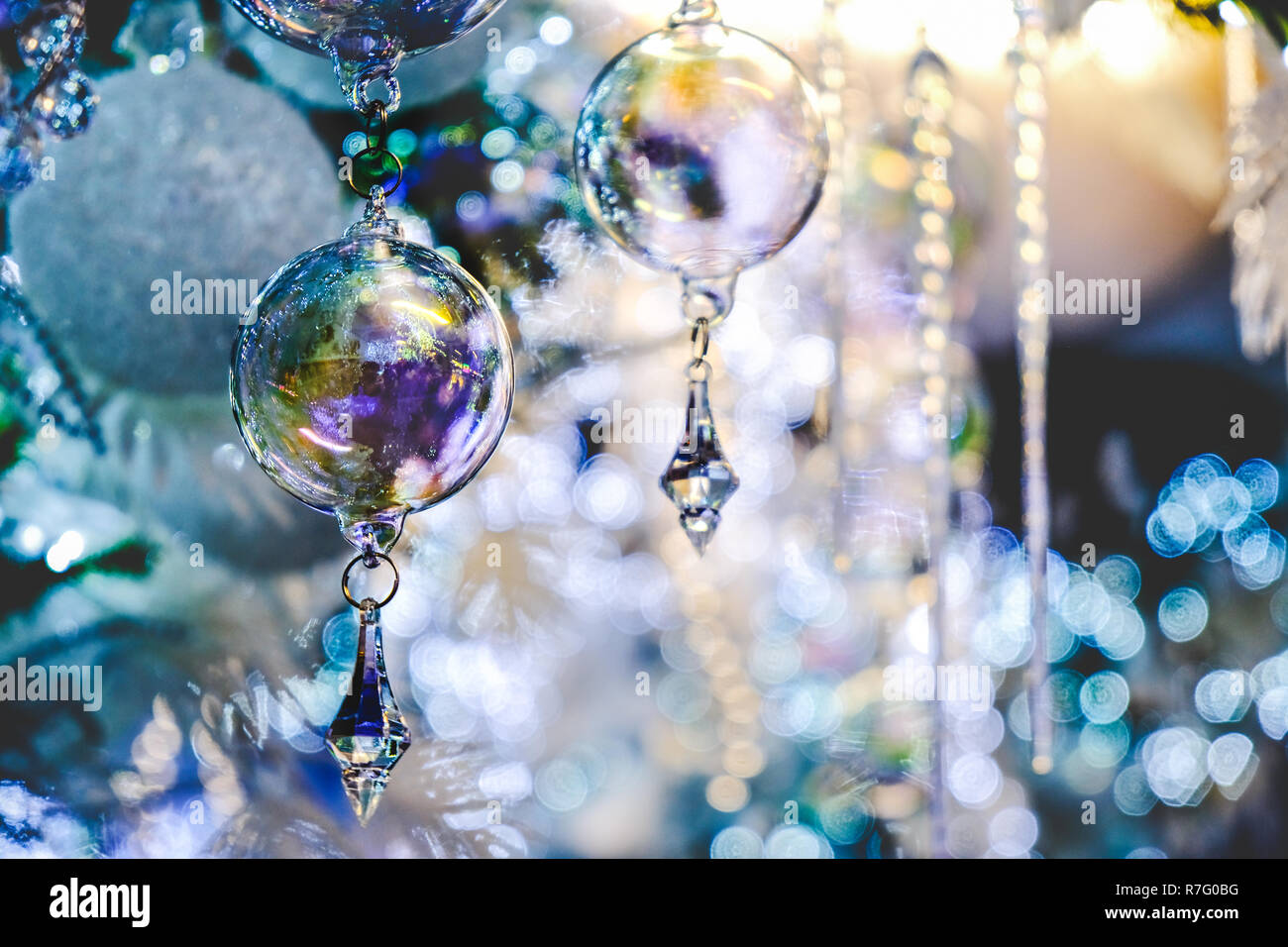 crystal ball christmas tree decoration blue background elegant closeup Stock Photo